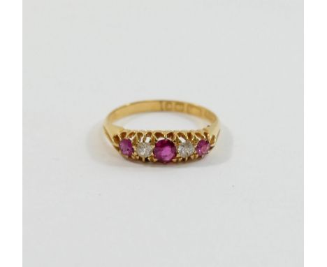 A late Victorian 18 carat gold ruby and diamond five stone ring, Birmingham 1898, the three round mixed cut rubies interspers