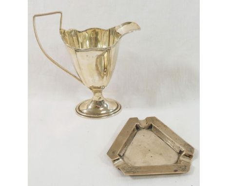A silver cream jug of Neoclassical design Birmingham 1911, 13.5cm high, and an Art Deco silver ash tray, Birmingham 1935, 8.5