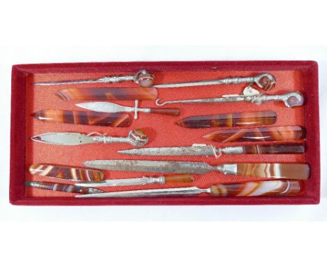 A quantity of banded carnelian handled items comprised of seven paper knives, a button hook, a book mark and a penknife and f