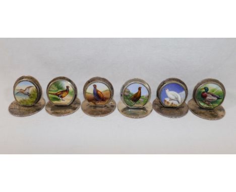 A set of six Sampson Mordan and Co. silver and enamel menu holder/place settings, each decorated with a circular enamel disc 