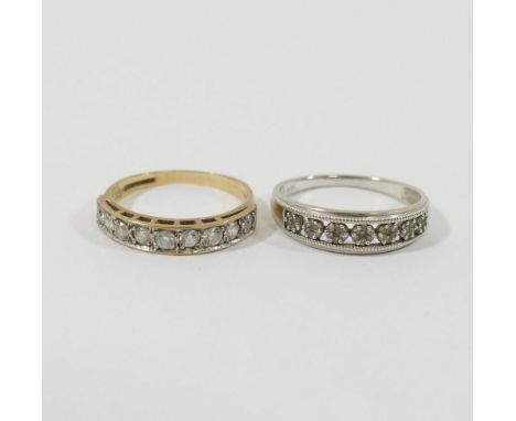 A 9 carat gold cubic zirconia set half eternity ring, Birmingham 1986, finger size Q, and a 9 carat white gold diamond half e