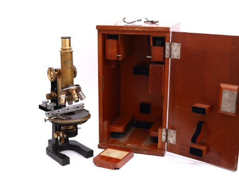 A Carl Zeiss Jena Compound Microscope, with four objectives and stage, with other accessories in wooden case marked 'Georg Ro