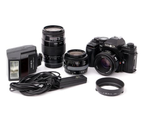 A Minolta 9000 SLR Camera, with AF f/1.7 50mm lens, together with AF Zoom f/4 35-70mm and Sigma AF f/3.5-4.5 35-135mm lenses 