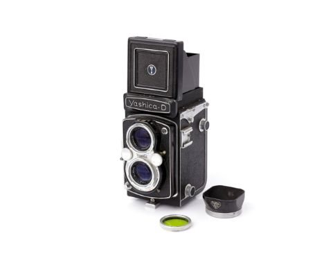 A Yashica-D TLR Camera, with Yashikor f/3.5 80mm lens, together with Rollei lens hood