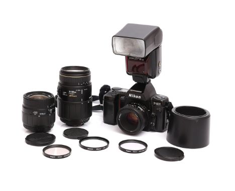 A Nikon F-801 SLR Camera, with AF Nikkor f/1.8 50mm, Sigma f/3.5-5.6 28-80mm and APO Macro f/4-5.6 70-300mm lenses, complete 