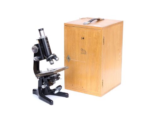 Watson Service Microscope, signed 'Watson Barnet', in light wood case with various lenses, magnification table in door dated 