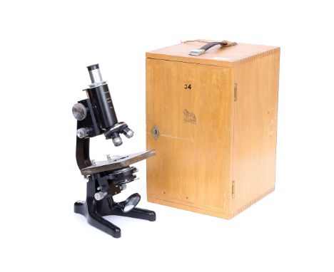 Watson Service Microscope, signed 'Watson Barnet', in light wood case with various lenses, magnification table in door dated 