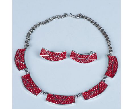 This retro set is made from silver tone metal with red enamel. The choker necklace measures approximately 15.75"L from end to