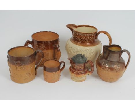 19th century stoneware tyg with three greyhound handles and applied hunting themed sprigging, 15cm high, together with three 