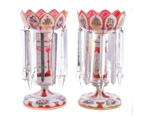 Good pair of 19th century Bohemian ruby overlaid glass lustres of typical form, with crenelated bowl, on column and spread fo