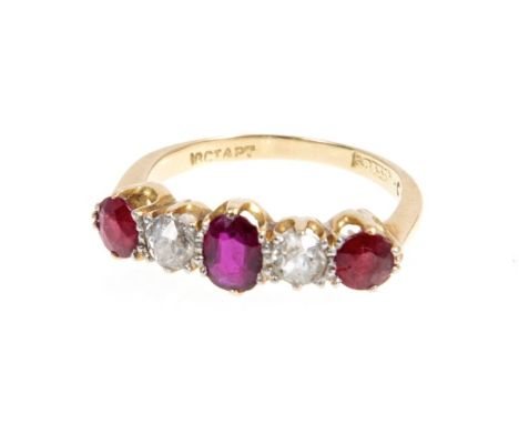 Victorian ruby and diamond five stone ring with three mixed cut rubies and two old cut diamonds in gold claw setting.  Ring s