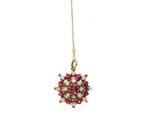 Victorian ruby and pearl snowflake design pendant / brooch, with oval mixed cut rubies and pearls in yellow metal setting, 30