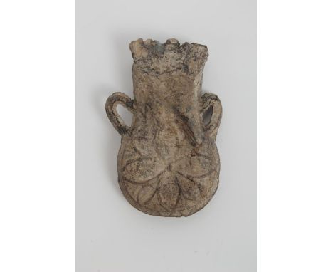 Late Medieval lead pilgrims' flask, twin-handled with flower-head ornament, 5cm high