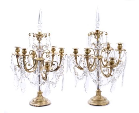 Pair of decorative gilt metal and cut glass candelabra, each with six scrolling candle sconces, each with six scrolling candl
