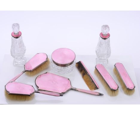 1930s seven piece silver and pink guilloche enamel dressing table set, comprising two pairs brushes, hand mirror, comb and cu