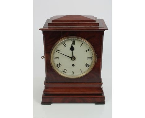 Early 19th century bracket clock with eight day fusee timepiece movement, white enamel dial with Roman numerals in a mahogany