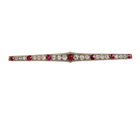 Edwardian ruby and diamond bar brooch with seven graduated mixed cut rubies interspaced by graduated old cut diamonds in mill