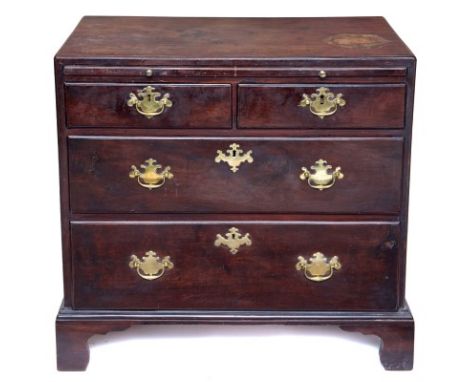 Early George III mahogany dressing chest of small proportions, with caddy moulded top and brushing slide above two short and 