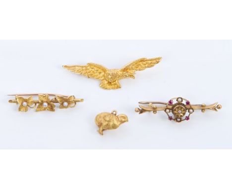 Late Victorian yellow metal brooch in the form of an eagle, Victorian yellow metal charm in the form of a chick and two Edwar