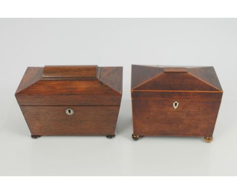 Regency mahogany tea caddy of sarcophagus form, with satinwood stringing, bone lock escutcheon and brass ball feet, hinged li