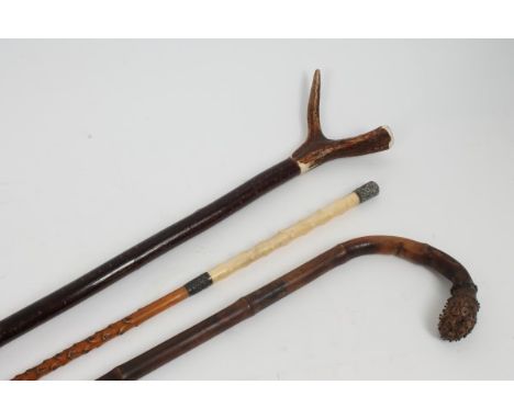 Edwardian Swaine & Adeney silver mounted, ivory-handled cane (London 1904), bamboo walking stick and a thumb stick (3)