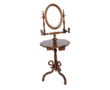 19th century French walnut shaving mirror, the oval swing mirrored plate between turned supports with flanking candle arms an