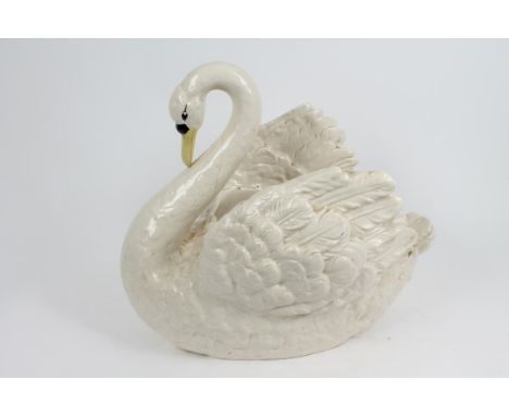 Late 19th century / early 20th century ceramic swan jardinière naturalistically modelled with hollow interior, 46cm high