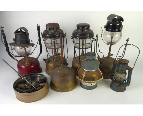THREE TILLEY LAMPS with brass tanks, ANOTHER with red enamelled tank, two SMALL LANTERNS and part of a Tilley Lamp (7) 
