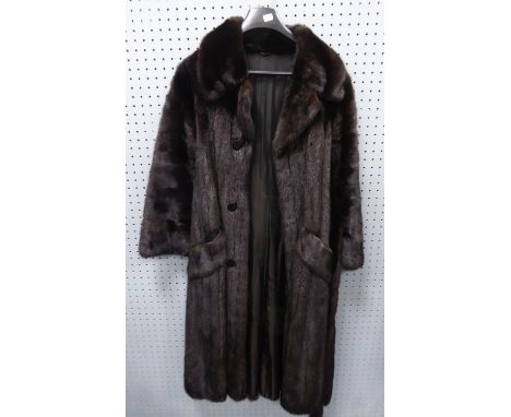 LADY'S LONG, FULL-LENGTH BLACK MINK COAT with broad revered collar, double-breasted with buttons but hook fastening, two pock