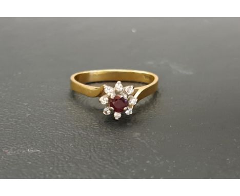 RUBY AND DIAMOND CLUSTER RINGon eighteen carat gold shank, approximately 3.7 grams 