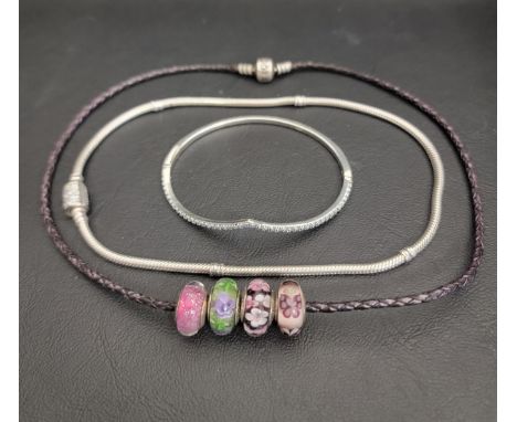 SELECTION OF PANDORA JEWELLERY comprising a Sparkling Wishbone silver bangle, a Pandora Moments double wrap sparkling barrel 