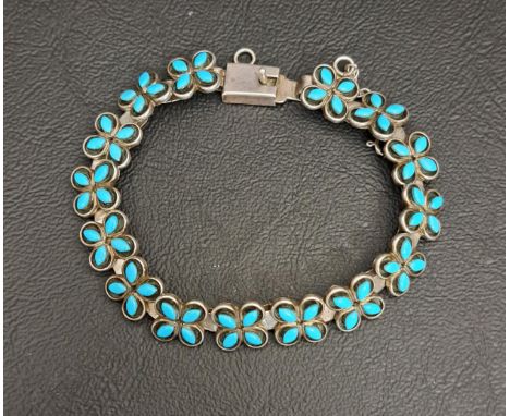 NATIVE AMERICAN TURQUOISE SET SILVER BRACELETwith quatrefoil links, marked 'Louis & Janice CHAVEZ III' 