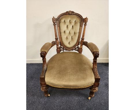 VICTORIAN WALNUT OPEN ARMCHAIRwith a shaped button back and outswept arms above a shaped stuffover seat, standing on turned f