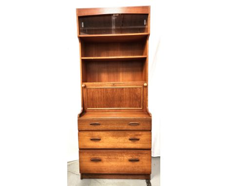 DANISH TEAK SECRETAIREwith a pair of sliding glass doors with interior light above two shelves with a panelled drop down door