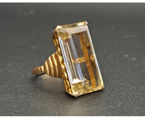 LARGE CITRINE SINGLE STONE DRESS RINGthe step cut citrine measuring approximately 24mm x 13mm x 8mm, on nine carat gold shank