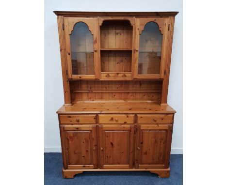 DUCAL PINE DRESSER the upper section with a central recess with two shelves flanked by a pair of glass cupboard doors, with a