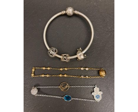 PANDORA MOMENTS STARS AND GALAXY SILVER BANGLEwith three Pandora charms; together with two Swarovski remix strands 