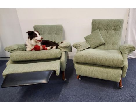 PAIR OF VINTAGE PARKER KNOLL RECLINING ARMCHAIRSmodel PK1041, with button backs, loose cushions and pop out leg rests, on sha