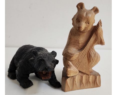 EAST ASIAN CARVED WOOD BEARseated upright playing a dongbula, 17.5cm high, together with a carved wood black bear, 8.5cm high