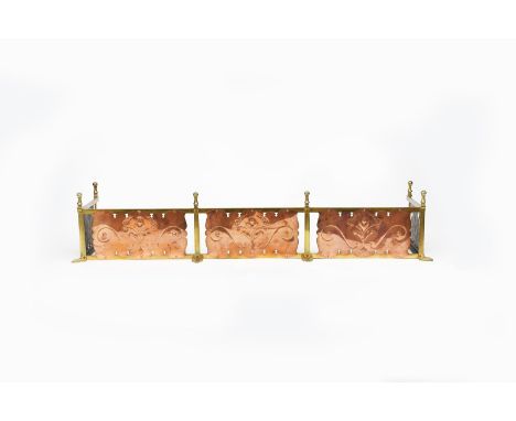 A W.A.S. Benson copper and brass fender, the frame on six heart shaped feet, set with repousse and engraved plaques designed 