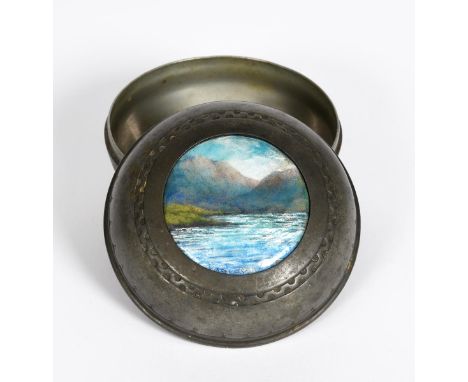A Liberty &amp; Co English Pewter and enamel circular box and cover, model no.01113, the circular domed cover cast in low rel