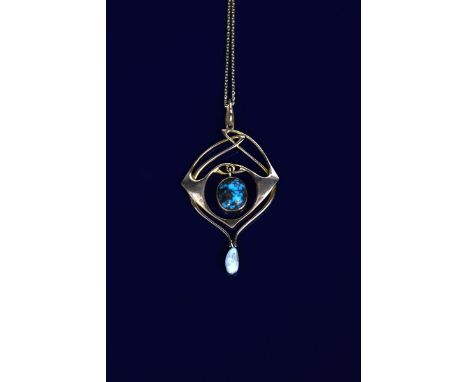 An Art Nouveau Liberty &amp; Co gold and turquoise pendant necklace designed by Archibald Knox,  model no. 500/95 the sinuous