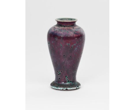 A Ruskin Pottery high-fired stoneware vase by William Howson Taylor, dated 1905, slender baluster form, covered in a purple g