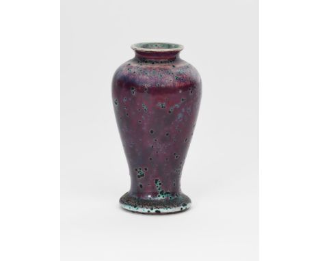 A Ruskin Pottery high-fired stoneware vase by William Howson Taylor, dated 1905, slender baluster form, covered in a purple g