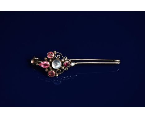 A silver stick pin brooch probably by Dorrie Nossiter, scrolling wirework set with central moonstone, flanked by a smaller mo