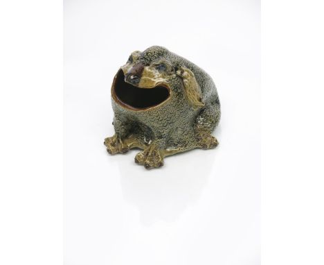 A fine Martin Brothers stoneware spoon warmer by Robert Wallace Martin,   the grotesque scaly creature with claw feet and lon