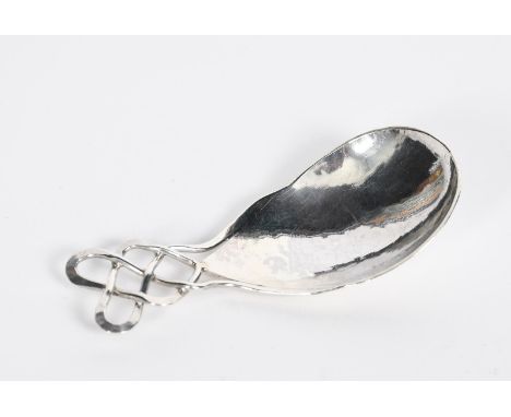 A Keswick School of Industrial Arts silver tea caddy spoon,  flaring tear-shaped bowl with hammered finish, interlaced wirewo