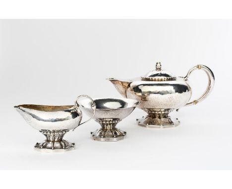 λ A Georg Jensen silver  three piece tea set probably designed by Johan Rohde, model no.181,  comprising teapot and cover, mi