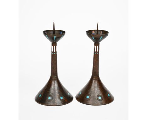 A pair of Deutsch Werkbund style patinated copper and enamel pricket candlesticks,  each tapering cylindrical bases, cylindri