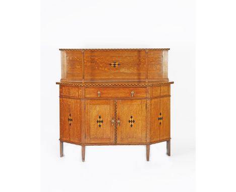 A Heal's oak sideboard designed by Ambrose Heal, possibly exhibited at the Paris Exposition 1900, of canted rectangular form,